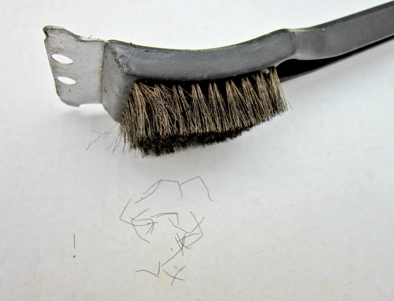 CNN article about metal bristle grill cleaning brushes.